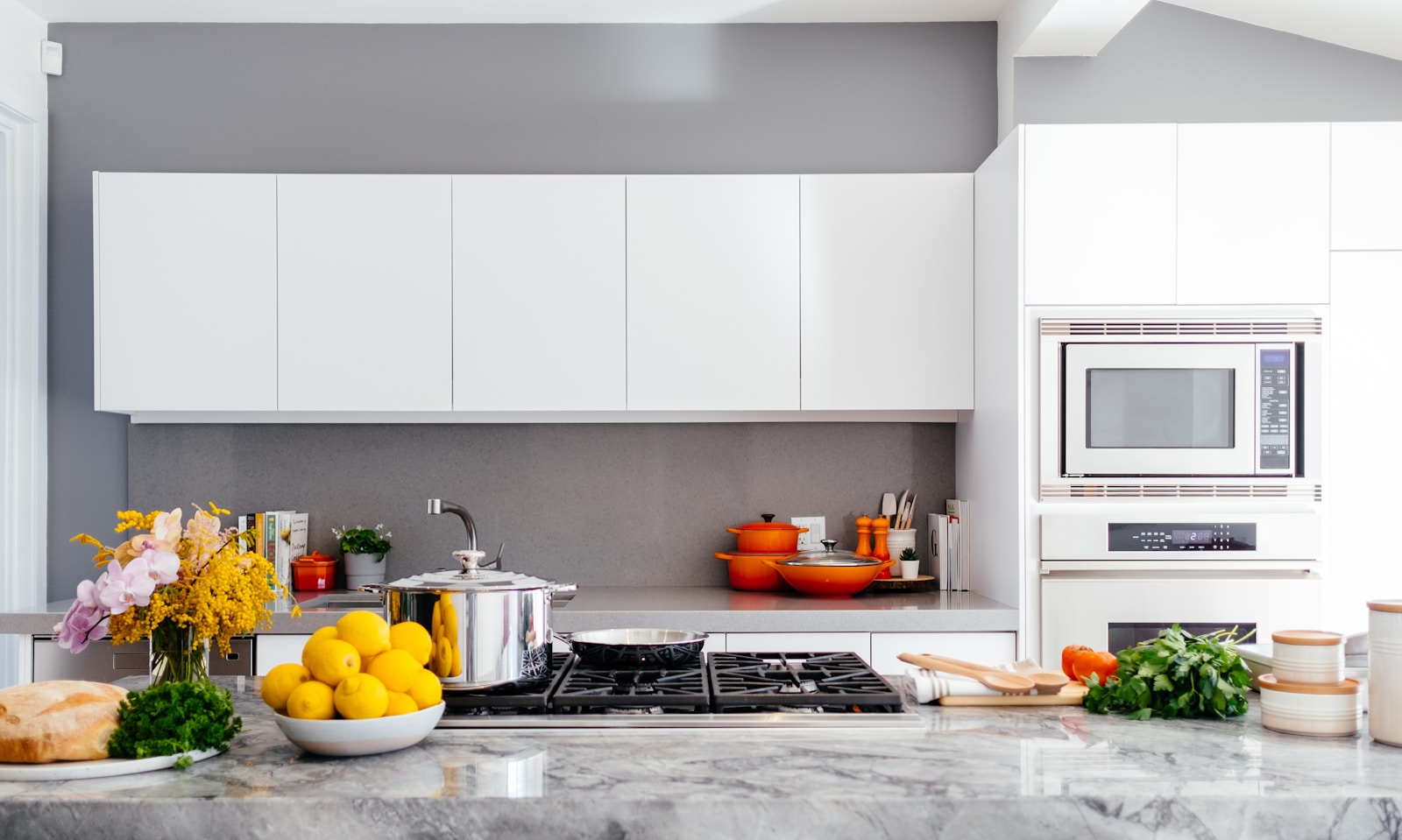 Modern kitchen with light countertops and appliances